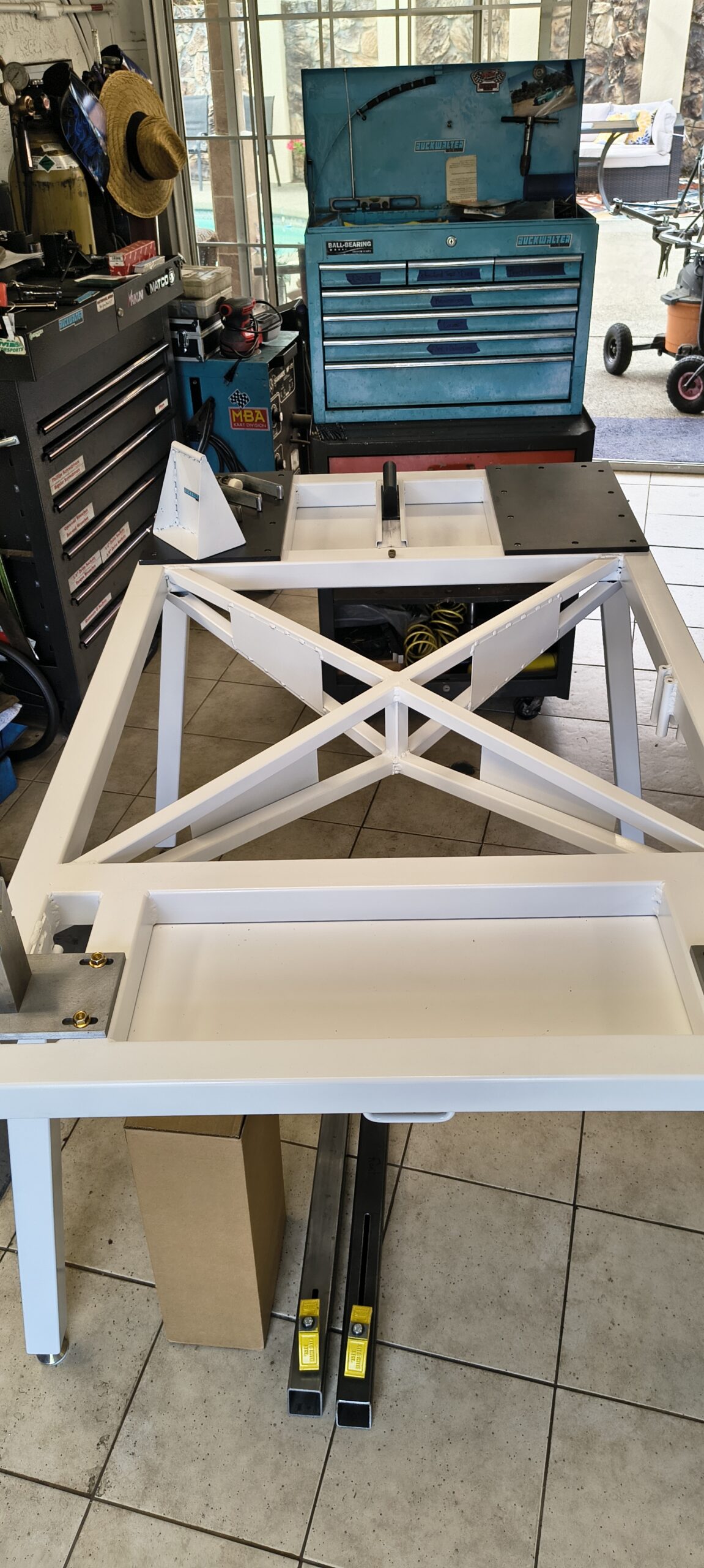 White chassis table in a karting workshop